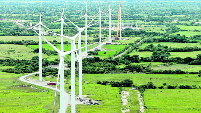 Landscape aerial photo showing the line up of the wind turbines.
